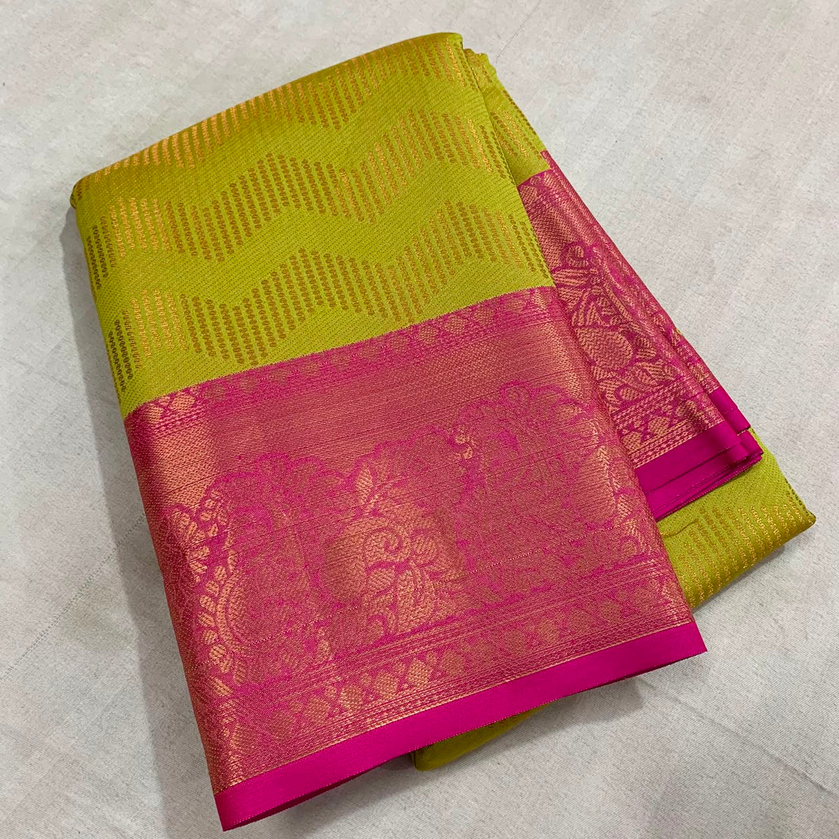 Vairoosi zigzag pattern in semi Kanchi silk saree with contrast rich pallu and contrast brocade blouse