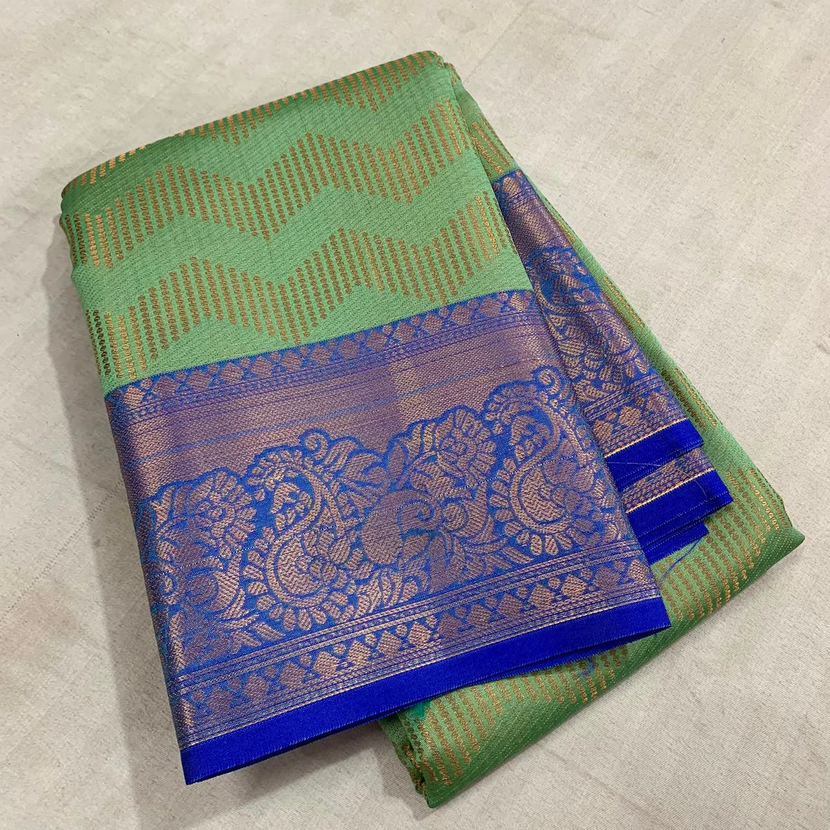 Vairoosi zigzag pattern in semi Kanchi silk saree with contrast rich pallu and contrast brocade blouse