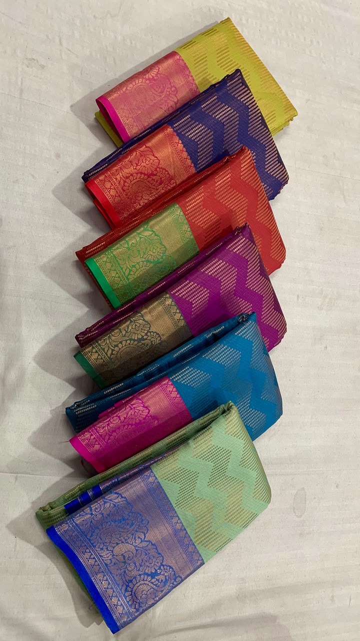 Vairoosi zigzag pattern in semi Kanchi silk saree with contrast rich pallu and contrast brocade blouse